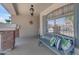 Inviting front porch features a comfortable bench and stylish decor at 23693 W Grove St, Buckeye, AZ 85326
