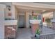 Charming front porch with brick accents, lantern lighting and a cozy seating area at 23693 W Grove St, Buckeye, AZ 85326