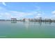 Scenic lake featuring a central fountain, surrounded by covered picnic areas and green spaces at 23693 W Grove St, Buckeye, AZ 85326