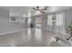 Spacious living room with grey wood flooring, and plenty of natural light at 23693 W Grove St, Buckeye, AZ 85326