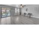 Bright living room with sliding glass door to back patio at 23693 W Grove St, Buckeye, AZ 85326