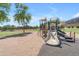 Neighborhood playground featuring a slide and climbing area with a sand base at 23693 W Grove St, Buckeye, AZ 85326