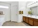 Bathroom with double sinks, plenty of counter space and storage in wood cabinets at 23862 W Chambers St, Buckeye, AZ 85326