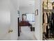 Bedroom view shows a dresser, mirror and a comfortable bed with view into walk-in closet at 23862 W Chambers St, Buckeye, AZ 85326