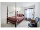 A Primary bedroom features a four-poster bed, soft carpet, and ample natural light at 23862 W Chambers St, Buckeye, AZ 85326
