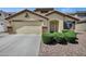 Charming single-story home showcasing a well-manicured front yard, attached garage, and inviting entrance at 23862 W Chambers St, Buckeye, AZ 85326
