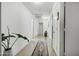 A long hallway features tile floors and access to multiple rooms in the home at 23862 W Chambers St, Buckeye, AZ 85326