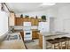 Efficient kitchen layout featuring laminate counters, ample cabinetry, and breakfast bar seating at 23862 W Chambers St, Buckeye, AZ 85326