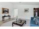 Inviting living space featuring a comfortable seating area, accent furniture, and decorative art at 23862 W Chambers St, Buckeye, AZ 85326
