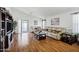 A bright living room offers hardwood floors, ample seating, and sliding glass door access at 23862 W Chambers St, Buckeye, AZ 85326