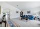 Bright and open living room with neutral carpeting, classic furnishings, and ample natural light at 23862 W Chambers St, Buckeye, AZ 85326