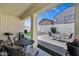 Covered patio with outdoor seating area providing a comfortable space to relax and enjoy the backyard view at 23862 W Chambers St, Buckeye, AZ 85326