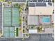 Aerial view of community tennis courts, parking lot, pool, and community center at 2400 E Baseline Ave # 71, Apache Junction, AZ 85119