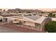 This home features solar panels, covered parking, and desert landscaping with views of the mountains at 2400 E Baseline Ave # 71, Apache Junction, AZ 85119