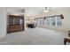 Expansive living area features bright windows, neutral carpet, and is perfect for entertaining and dining at 2400 E Baseline Ave # 71, Apache Junction, AZ 85119