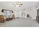 Inviting living room with neutral carpet, ceiling fan, and bright windows for a welcoming atmosphere at 2400 E Baseline Ave # 71, Apache Junction, AZ 85119