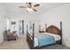 Bright main bedroom featuring an ensuite bathroom and cozy seating at 2400 E Baseline Ave # 71, Apache Junction, AZ 85119