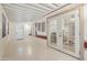 Enclosed patio with access to laundry and view to inside of home at 2400 E Baseline Ave # 71, Apache Junction, AZ 85119