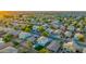 This aerial view shows a well-planned community with neatly arranged homes and green spaces at 2533 W Novak Way, Phoenix, AZ 85041