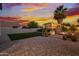 Backyard at dusk featuring a unique custom playhouse and seating area at 2533 W Novak Way, Phoenix, AZ 85041