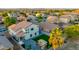 Wide aerial view of backyard with green synthetic lawn and stone patio with playset at 2533 W Novak Way, Phoenix, AZ 85041
