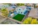 Aerial view of a fenced backyard featuring green synthetic lawn and patio with playset at 2533 W Novak Way, Phoenix, AZ 85041