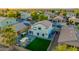 Aerial view of the backyard features green lawn, patio area, and playset at 2533 W Novak Way, Phoenix, AZ 85041