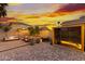 Backyard highlighting outdoor seating, a sauna and custom potted trees at 2533 W Novak Way, Phoenix, AZ 85041