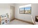Bright ' bedroom with a view from the window and a toy kitchen at 2533 W Novak Way, Phoenix, AZ 85041