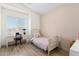 Cozy bedroom with a twin bed, desk by the window, and wood-style flooring at 2533 W Novak Way, Phoenix, AZ 85041