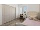 Bedroom featuring a twin bed, desk near the window, wood-style floors, and closet at 2533 W Novak Way, Phoenix, AZ 85041