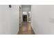 Hallway showcasing wood-look tile and modern stainless steel washer and dryer at 2533 W Novak Way, Phoenix, AZ 85041