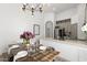 Contemporary kitchen with stainless steel appliances and adjoining dining area at 2533 W Novak Way, Phoenix, AZ 85041