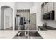 Bright kitchen featuring stainless steel appliances, quartz countertops, and neutral-tone cabinets at 2533 W Novak Way, Phoenix, AZ 85041