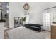 Spacious living room with high ceiling, natural light, and modern grey sofa at 2533 W Novak Way, Phoenix, AZ 85041
