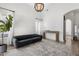 Open living room with high ceiling, natural light, and modern grey sofa at 2533 W Novak Way, Phoenix, AZ 85041