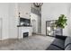 Open living room with fireplace, modern finishes, and large sliding glass doors at 2533 W Novak Way, Phoenix, AZ 85041