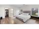 Bright main bedroom features wood-look floors, en-suite bath, and walk-in closet at 2533 W Novak Way, Phoenix, AZ 85041