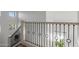 Upstairs staircase with modern, decorative metal balusters, and an abundance of light at 2533 W Novak Way, Phoenix, AZ 85041