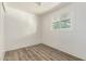 Bedroom featuring natural light and wood-look floors, and white walls and trim at 2650 W Union Hills Dr # 29, Phoenix, AZ 85027