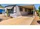 Charming mobile home with covered parking, desert landscaping, and a well-maintained exterior at 2650 W Union Hills Dr # 29, Phoenix, AZ 85027