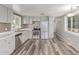 Modern kitchen with stainless steel appliances, gray cabinets, and stylish backsplash tiles at 2650 W Union Hills Dr # 29, Phoenix, AZ 85027