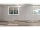 Bright living room with modern flooring, fresh paint, and updated windows and fixtures at 2650 W Union Hills Dr # 29, Phoenix, AZ 85027