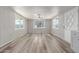 Open-concept living room featuring modern wood flooring, fresh paint, and plenty of natural light at 2650 W Union Hills Dr # 29, Phoenix, AZ 85027
