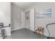 Versatile flex space featuring exercise equipment and neutral tones at 29403 N 119Th Ln, Peoria, AZ 85383