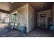 Inviting covered front porch with stylish décor and a cozy seating area near the front door at 29403 N 119Th Ln, Peoria, AZ 85383