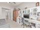 Bright office featuring built-in shelving, a desk, and a comfortable daybed at 29403 N 119Th Ln, Peoria, AZ 85383