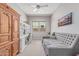 Inviting office space with a comfortable daybed, desk, and ample built-in storage at 29403 N 119Th Ln, Peoria, AZ 85383