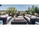 Relaxing outdoor seating area with comfortable sofas and a charming water fountain feature at 29403 N 119Th Ln, Peoria, AZ 85383