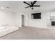 Spacious bedroom featuring a ceiling fan and a flat screen TV at 302 N 69Th Pl, Mesa, AZ 85207